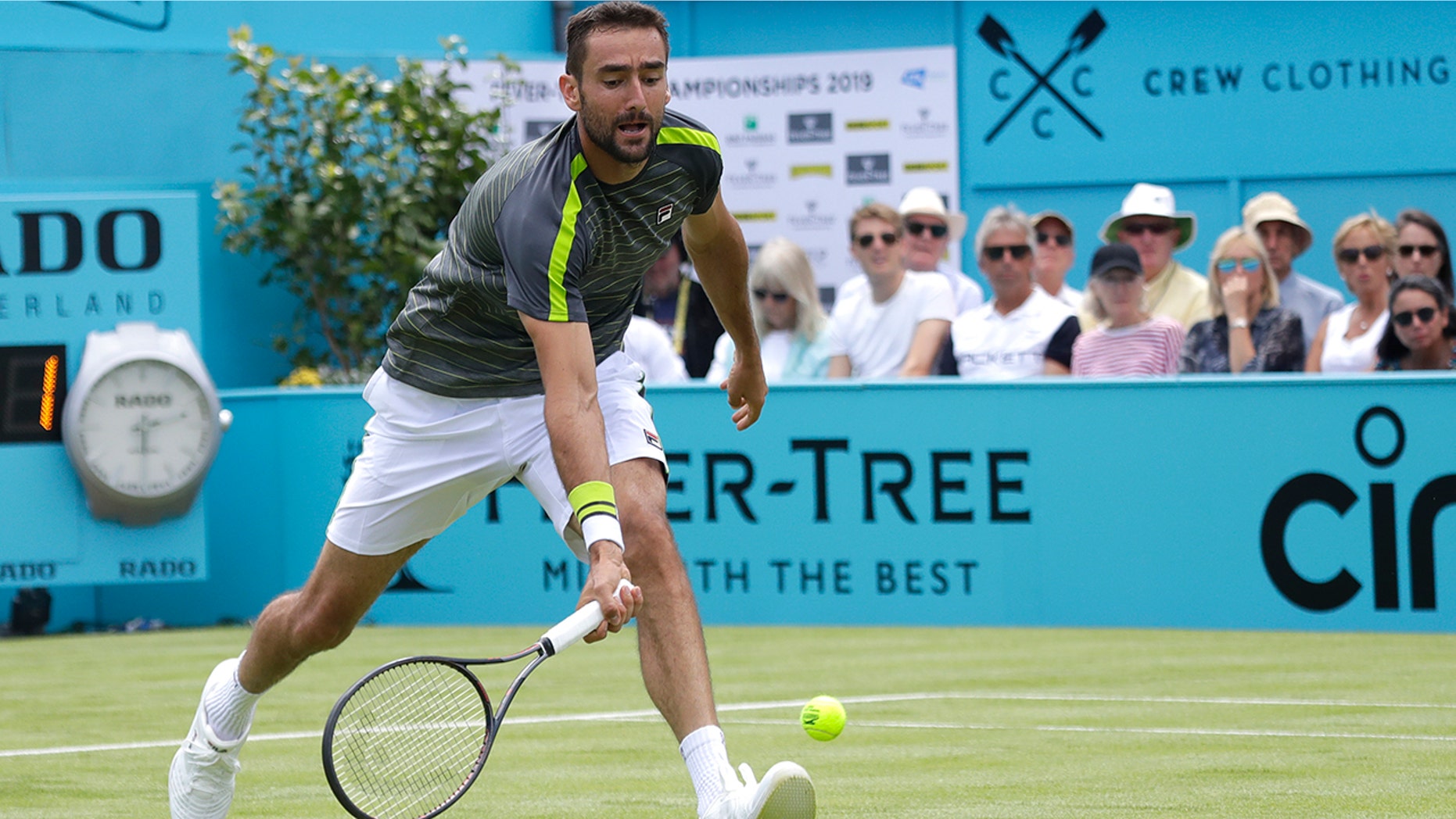 Marin Cilic of Croatia plays a return to Cristian Garin of Chile during their singles match at the Queens Club tennis tournment in London, Monday, June 17, 2019. (AP Photo/Kirsty Wigglesworth)