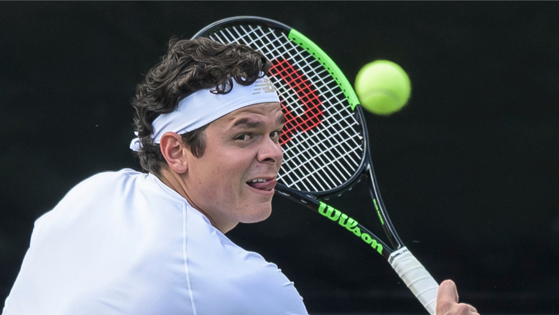 Canada's Milos Raonic returns the ball to Jo-Wilfried Tsonga of France during their match at the ATP tennis event in Stuttgart, Germanany Wednesday June 12, 2019. (Silas Stein/dpa via AP)