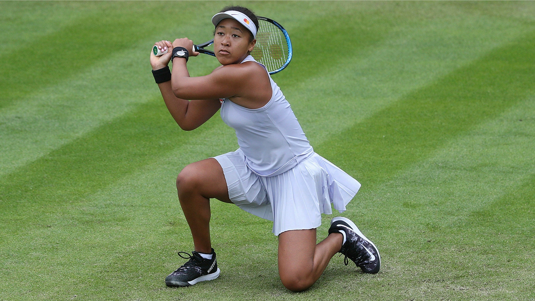 Japan's Naomi Osaka returns to Greece's Maria Sakkari during day four of the Nature Valley Classic at Edgbaston Priory Club, Birmingham, England, Tuesday, June 18, 2019. (David Davies/PA via AP)