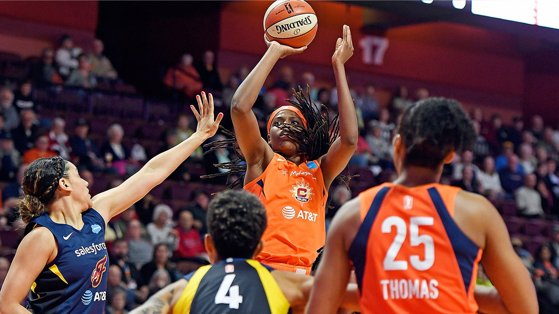 FILE - In this May 28, 2019, file photo, Connecticut Sun center Jonquel Jones shoots over the Indiana Fever defense during a WNBA basketball game, in Uncasville, Conn. Led by Jones, the Sun (8-1) have won their last six games and have started to put a little distance between themselves and the rest of the league. (Sean D. Elliot/The Day via AP, File)