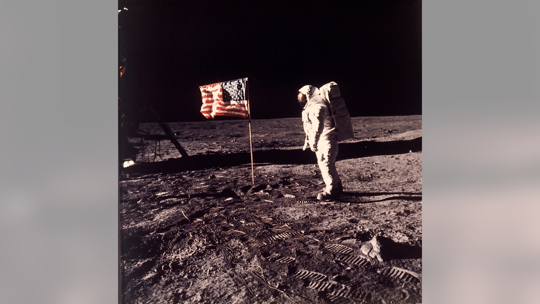 FILE - In this image provided by NASA, astronaut Buzz Aldrin poses for a photograph beside the U.S. flag deployed on the moon during the Apollo 11 mission on July 20, 1969. A new poll shows most Americans prefer focusing on potential asteroid impacts over a return to the moon. The survey by The Associated Press and the NORC Center for Public Affairs Research was released Thursday, June 20, one month before the 50th anniversary of Neil Armstrong and Aldrinâ€™s momentous lunar landing. (Neil A. Armstrong/NASA via AP)