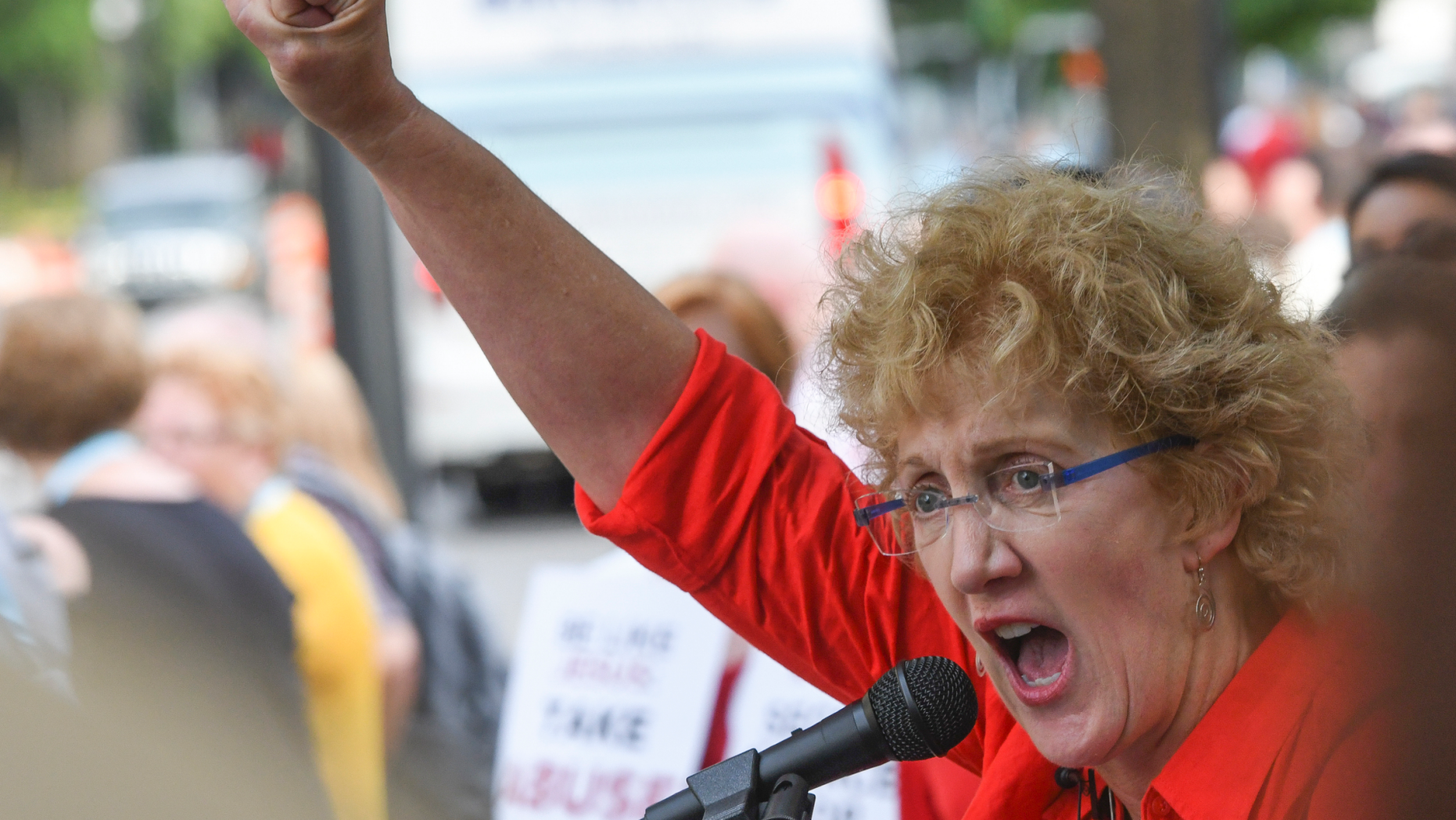 Christa Brown, of Denver, Colo., speaks outside the Southern Baptist Convention's annual meeting Tuesday, June 11, 2019, during a rally in Birmingham, Ala. (AP Photo/Julie Bennett)