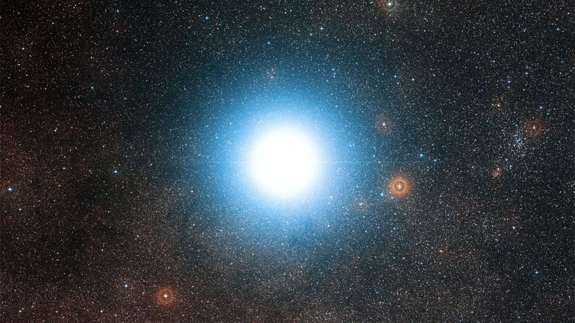 A new planet-hunting instrument has begun studying our bright neighboring star system, Alpha Centauri. Credit: ESO/Digitized Sky Survey 2 Acknowledgement: Davide De Martin