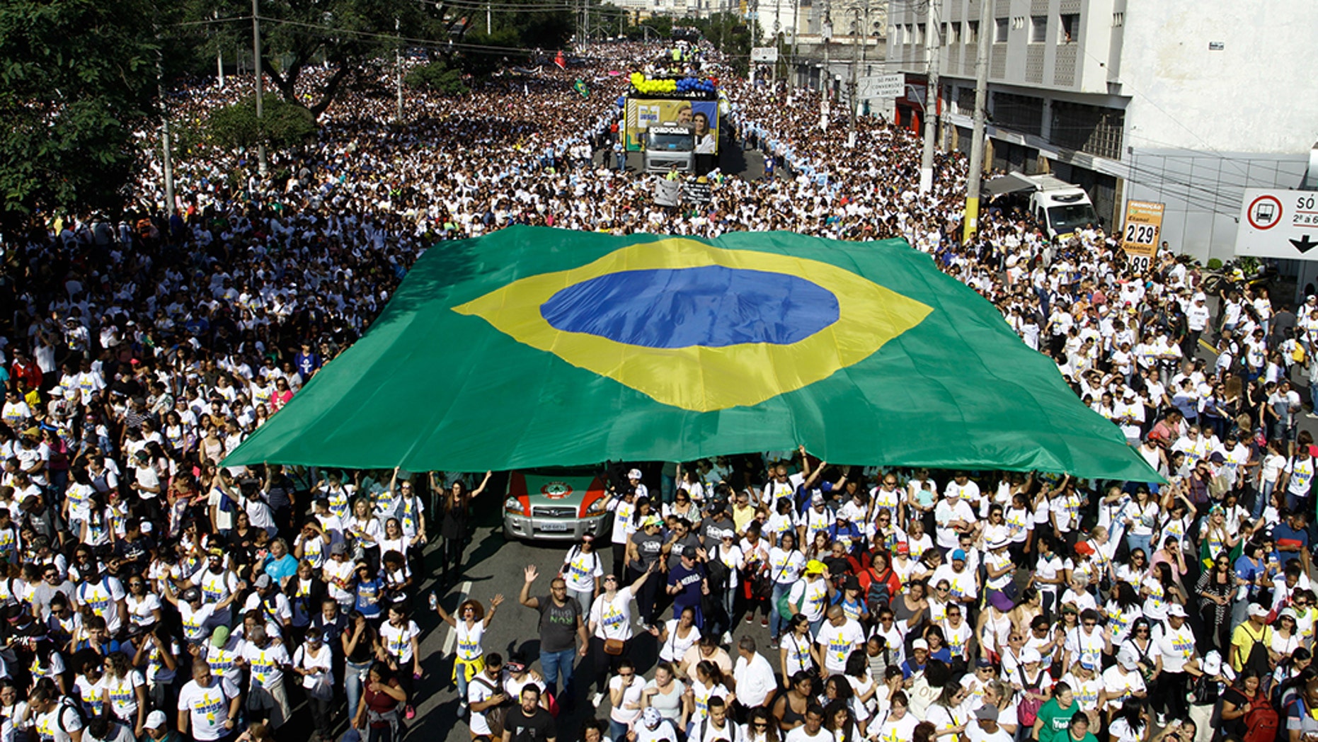 People take part in the 27th edition of March for Jesus, in Sao Paulo, Brazil, on June 20, 2019. "March For Jesus" is the largest evangelical event in Brazil. (Photo by Fabio Vieira/FotoRua/NurPhoto via Getty Images)