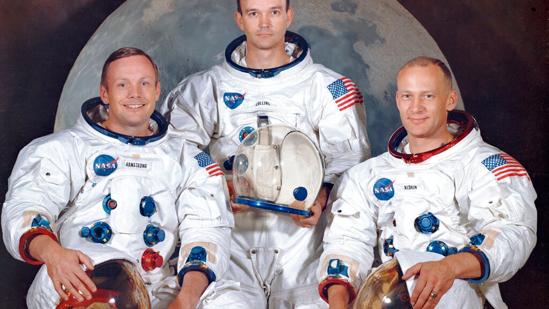 This March 30, 1969 photo made available by NASA shows the crew of the Apollo 11, from left, Neil Armstrong, commander; Michael Collins, module pilot; Edwin E. "Buzz" Aldrin, lunar module pilot. Apollo 11 was the first manned mission to the surface of the moon. (NASA via AP)