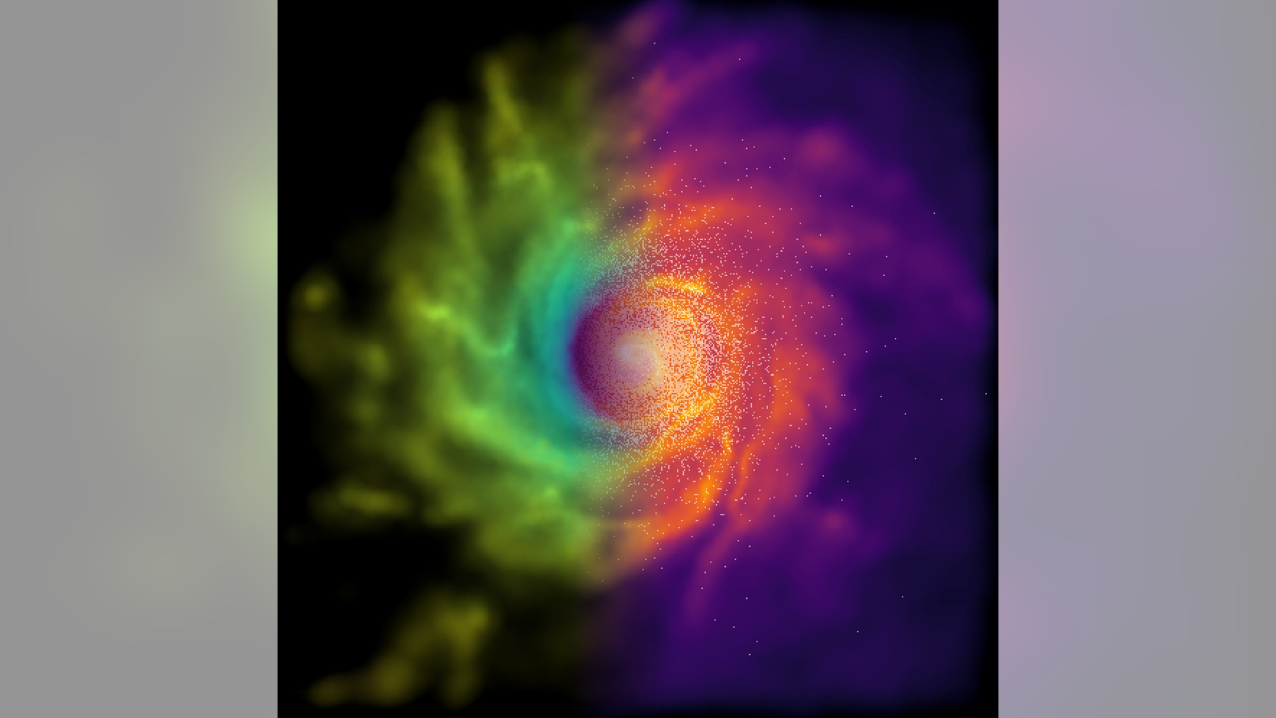 The simulated galaxy visualized from above, the dark central regions corresponding to the standard forces and the bright yellow regions corresponding to the modified forces.