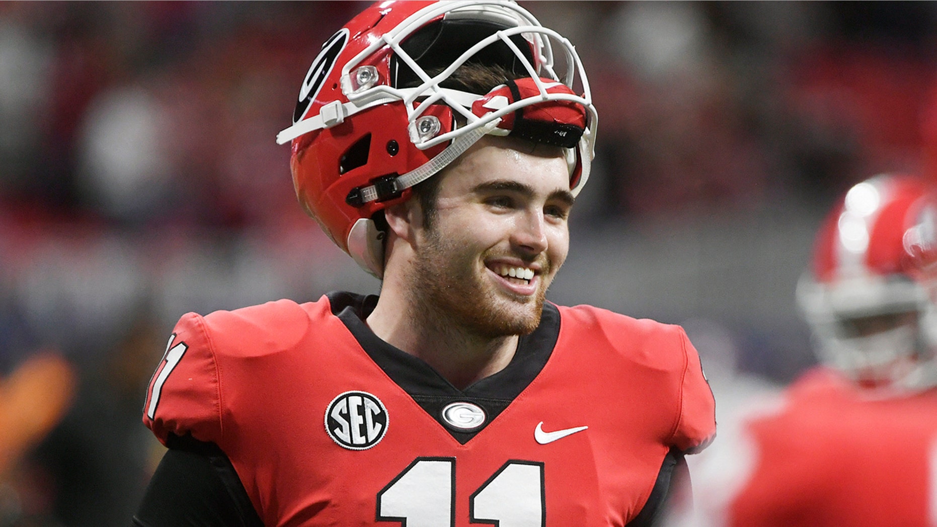 FILE - In this Dec. 1, 2018, file photo, Georgia quarterback Jake Fromm warms up before the Southeastern Conference championship NCAA college football game against Alabama in Atlanta. This year, a group of talented and experienced quarterbacks could help the SEC produce a little more drama. Georgia’s Fromm, LSU’s Joe Burrow, Florida’s Feleipe Franks and Texas A&M’s Kellen Mond are among the biggest reasons all those teams feel they have a realistic chance of knocking Alabama off its title perch. (AP Photo/John Amis, File)