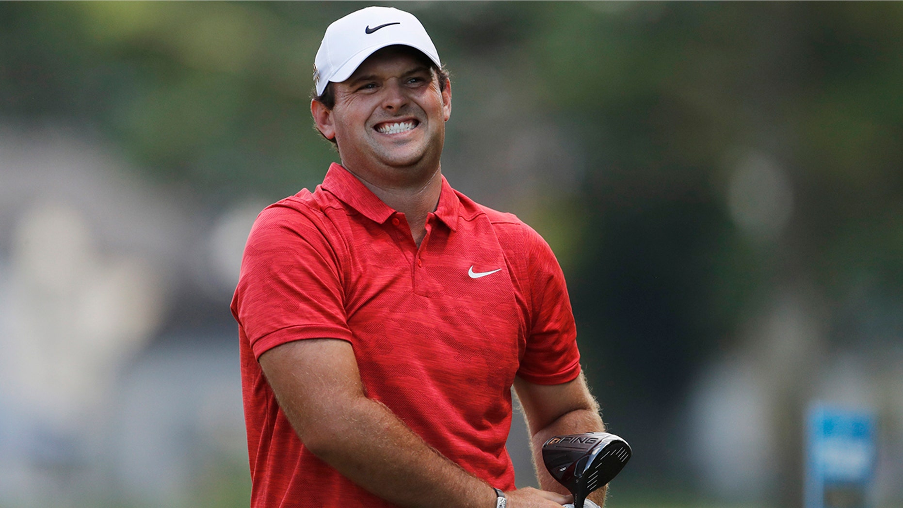 Patrick Reed reacts to his tee shot on No. 17 during the third round of the Rocket Mortgage Classic golf tournament Saturday, June 29, 2019, in Detroit. (AP Photo/Carlos Osorio)