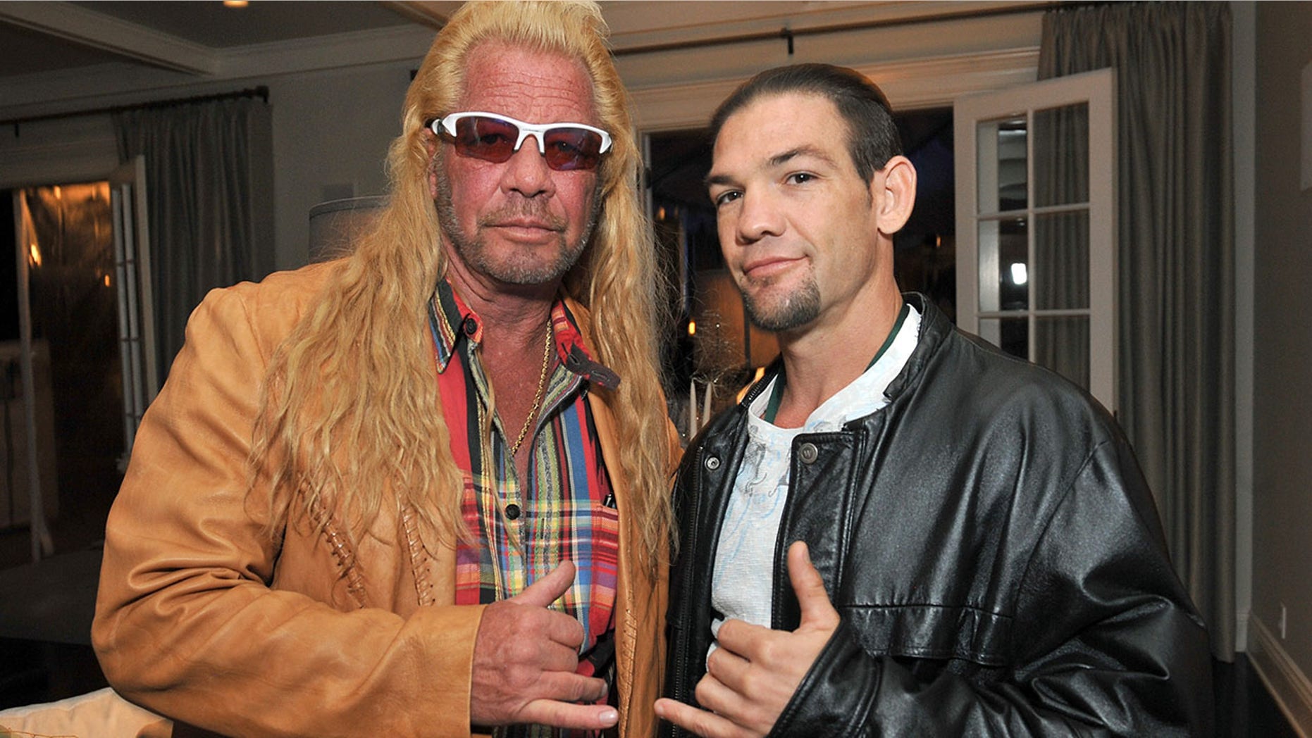 LOS ANGELES, CA - DECEMBER 12: Dog Chapman and Leland Chapman attend the 2013 Electus & College Humor Holiday Party at a private residency on December 12, 2013 in Los Angeles, California. (Photo by Angela Weiss/Getty Images for Electus)