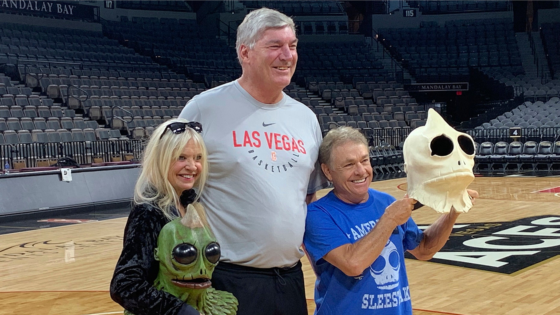 Bill Laimbeer, center, coach of the WNBA's Las Vegas Aces basketball team, poses for photos with Kathy Coleman, left, and Wesley Eure on Tuesday, July 30, 2019, in Las Vegas. (AP Photo/Doug Feinberg)