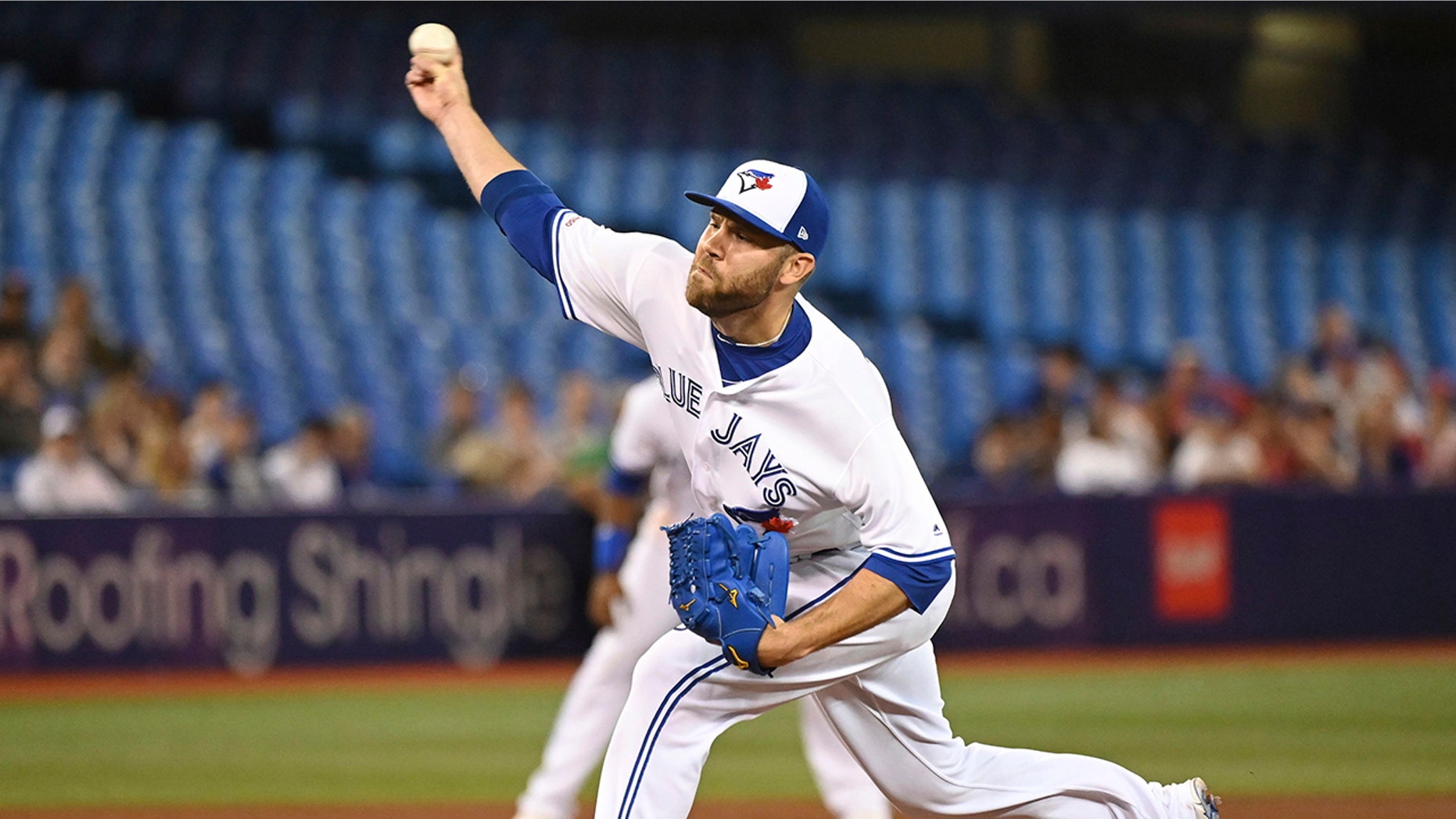 FILE - In this Friday, June 28, 2019 file photo, Toronto Blue Jays' David Phelps pitches against the Kansas City Royals during the sixth inning of a baseball game in Toronto. The Cubs added bullpen depth by acquiring right-hander David Phelps from Toronto for minor league righty Thomas Hatch, Tuesday, July 30, 2019. (Jon Blacker/The Canadian Press via AP, File)