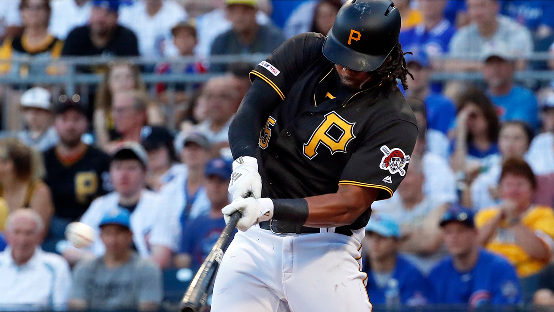 FILE - In this July 1, 2019, file photo, Pittsburgh Pirates' Josh Bell hits a three-run home run off Chicago Cubs starting pitcher Adbert Alzolay during the first inning of a baseball game in Pittsburgh. Bell is among eight competitors in this year’s All-Star Game Home Run Derby, which is handing out a $1 million prize to the winner. (AP Photo/Gene J. Puskar, File)
