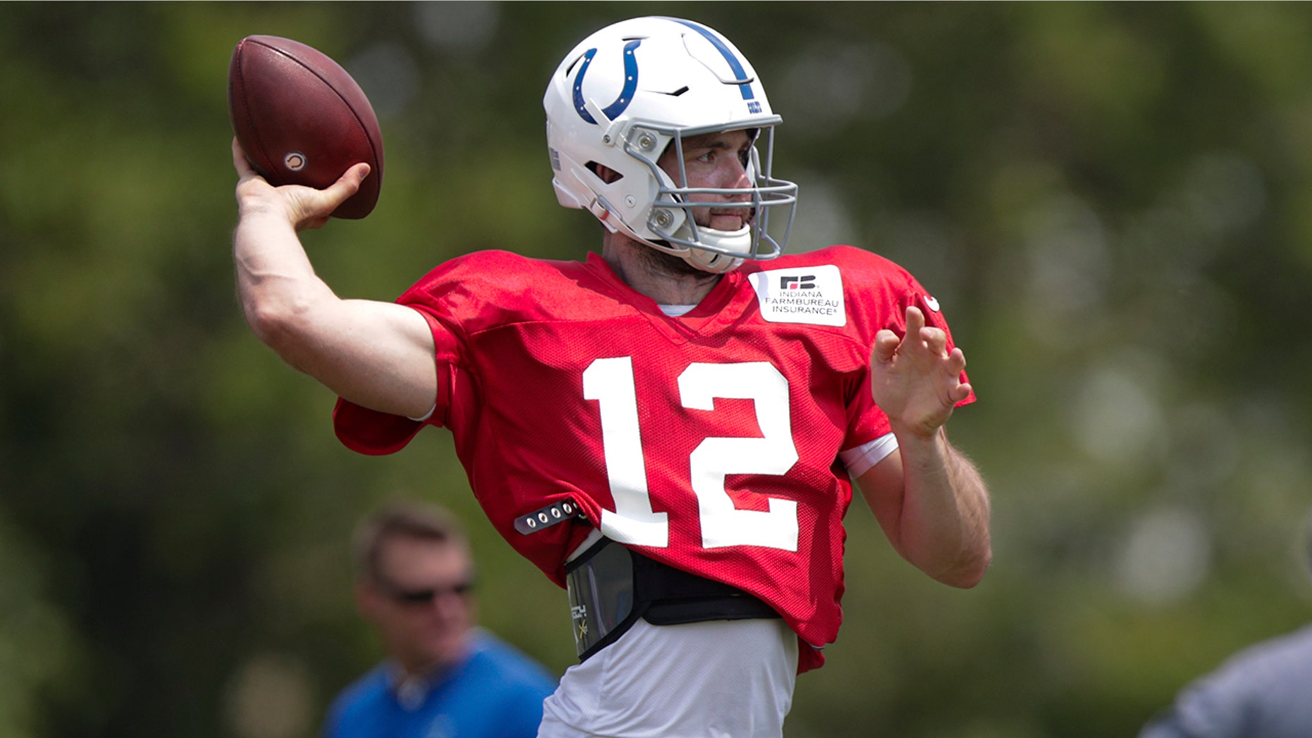 Indianapolis Colts quarterback Andrew Luck (12) throws during practice at the NFL team's football training camp in Westfield, Ind., Sunday, July 28, 2019. (AP Photo/Michael Conroy)