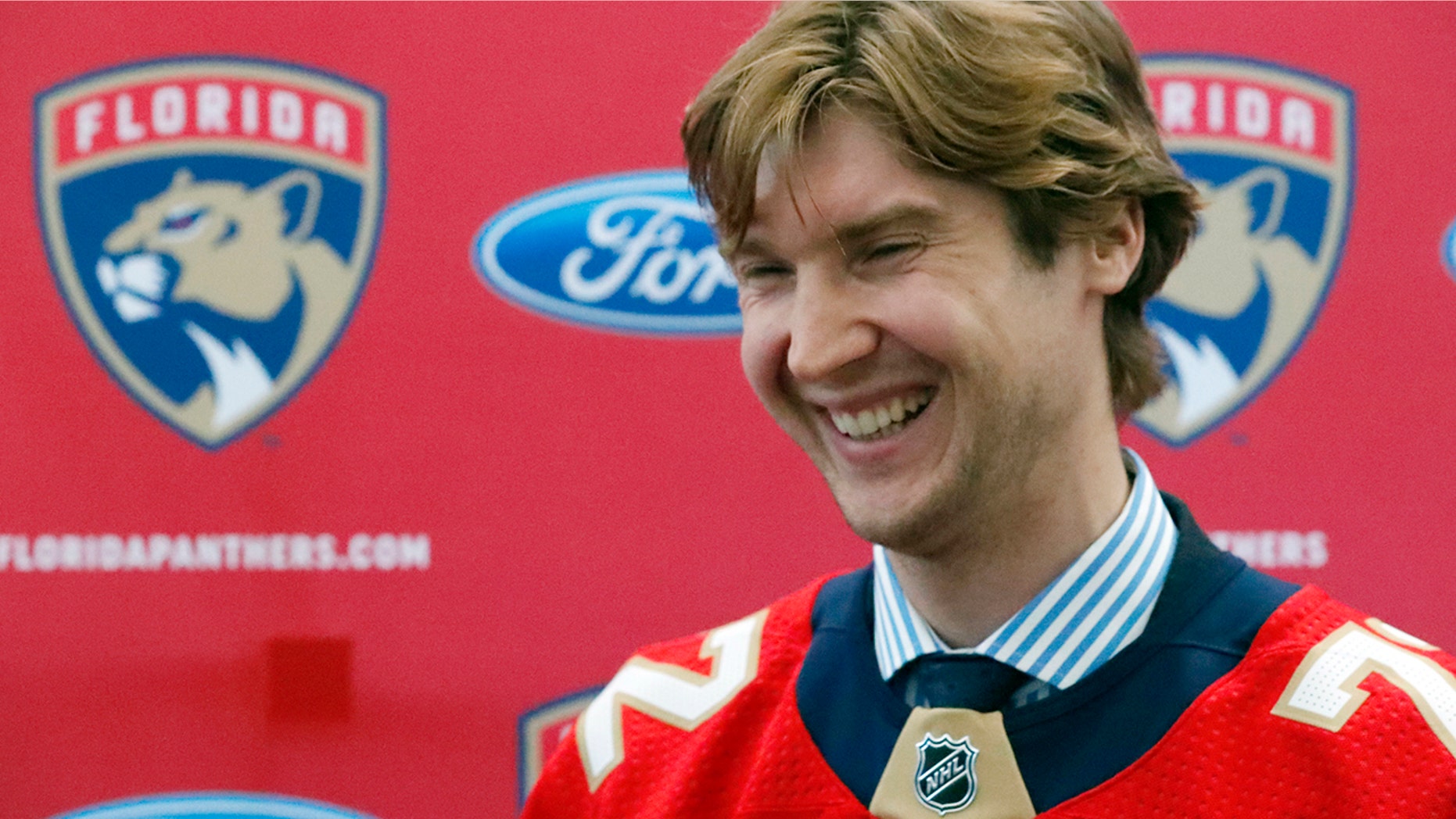 Florida Panthers new goaltender Sergei Bobrovsky laughs as he speaks during an NHL hockey news conference, Tuesday, July 2, 2019, in Sunrise, Fla. The Panthers introduced Bobrovsky, Anton Stralman, Brett Connolly and Noel Acciari. The Panthers, New York Rangers and Nashville Predators were winners on Day 1 of NHL free agency. (AP Photo/Wilfredo Lee)