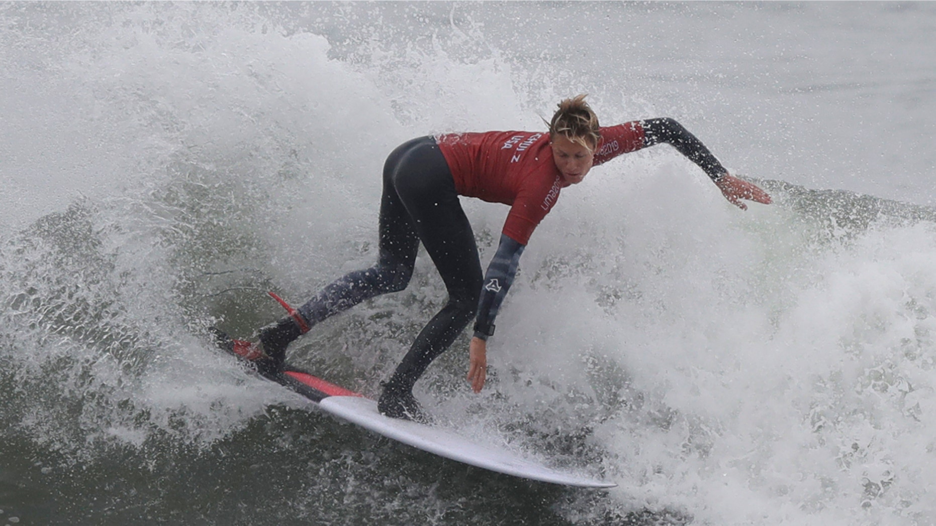 Kevin Schulz of the United States competes in the men's open surfing main round 1, during the Pan American Games on Punta Rocas beach in Lima Peru, Monday, July 29, 2019. (AP Photo/Silvia Izquierdo)