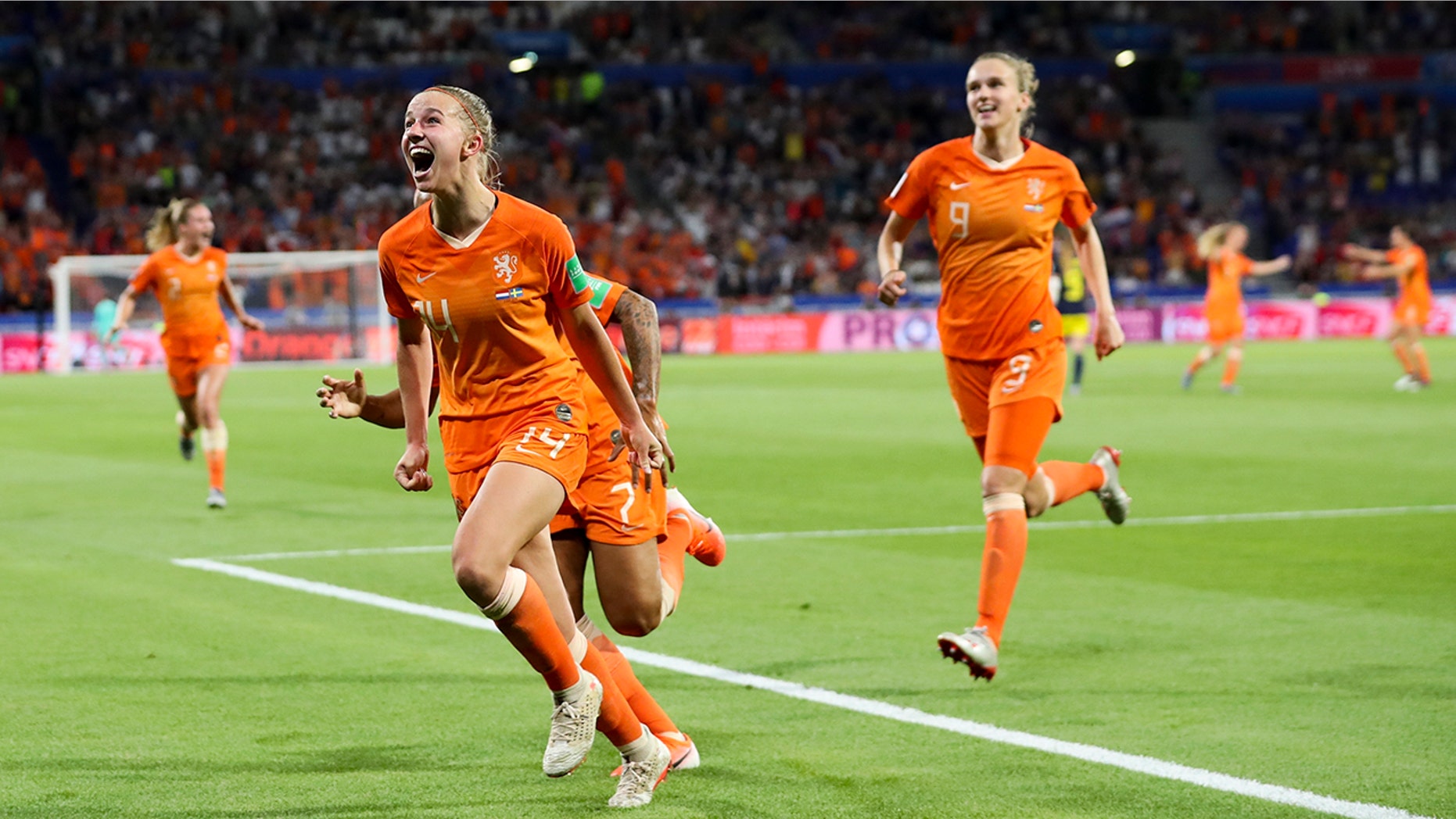 Netherlands' Jackie Groenen, foreground, celebrates after scoring during the Women's World Cup semifinal soccer match between the Netherlands and Sweden, at the Stade de Lyon outside Lyon, France, Wednesday, July 3, 2019. (AP Photo/Francisco Seco)
