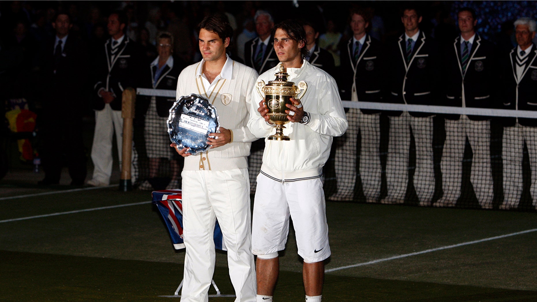 FILE - In this Sunday, July 6, 2008 file photo Spain's Rafael Nadal right, stands with the winners trophy next to Switzerland's Roger Federer after the men's singles final on the Centre Court at Wimbledon. After going more than 1½ years without playing each other anywhere, Roger Federer and Rafael Nadal will be meeting at a second consecutive Grand Slam tournament when they face off in Wimbledon's semifinals. (AP Photo/Kirsty Wigglesworth, File)