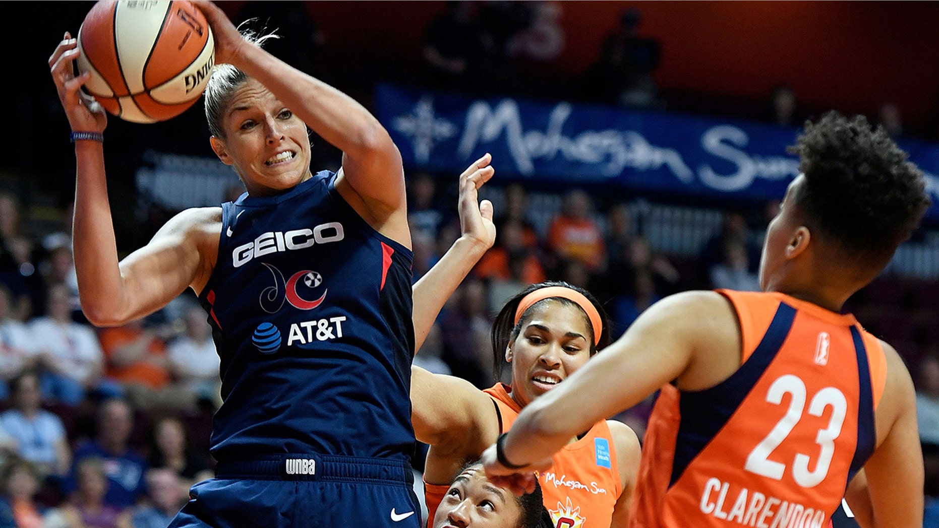 FILE - In this June 11, 2019, file photo, Washington Mystics forward Elena Delle Donne pulls down a rebound next to Connecticut Sun guard Layshia Clarendon during a WNBA basketball game in Uncasville, Conn. Thibault’s squad has been using a stellar defensive effort to win five in a row and now sit atop The Associated Press WNBA power poll. The Mystics are second in the league allowing just 73.2 points a game. (Sean D. Elliot/The Day via AP, File)