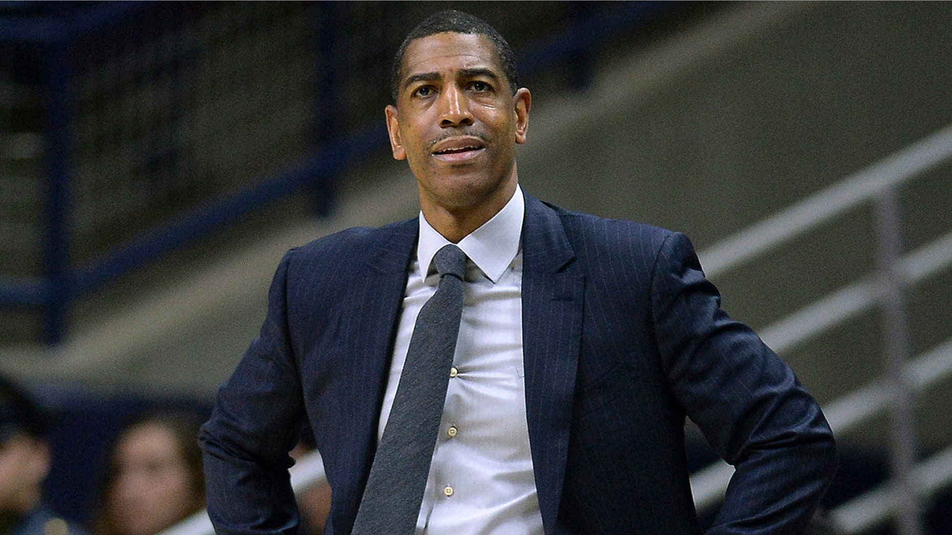 FILE - In this Feb. 7, 2018, file photo, Connecticut head coach Kevin Ollie watches from the sideline during the first half an NCAA college basketball game in Storrs, Conn. (AP Photo/Jessica Hill, File)