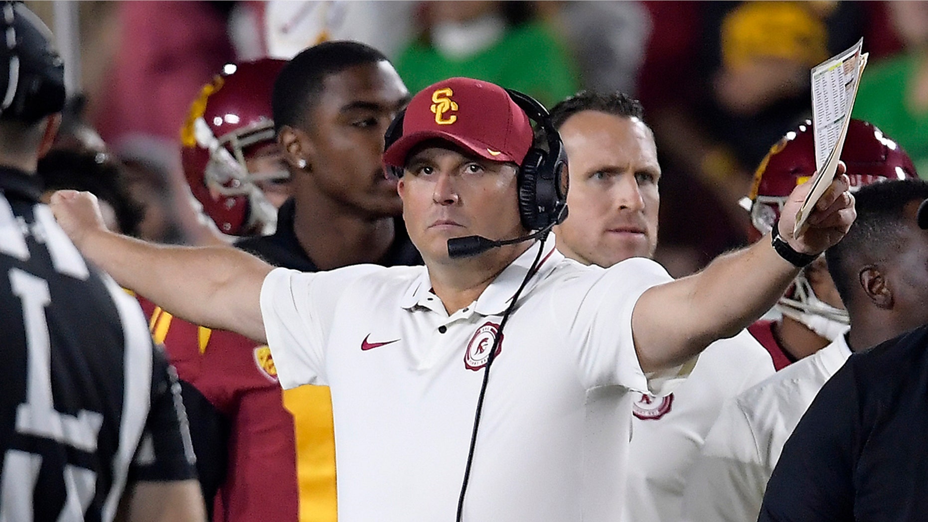FILE - In this Nov. 24, 2018, file photo, Southern California head coach Clay Helton gestures during the first half of an NCAA college football game against Notre Dame in Los Angeles. Helton went 21-6 with a Rose Bowl victory and Pac-12 title in his first two full seasons as USC coach, but his job status is one of the stories of the 2019 season. (AP Photo/Mark J. Terrill, File)
