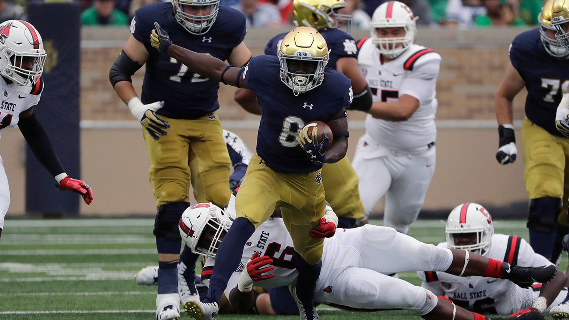FILE - In this Sept. 8, 2018, file photo, Notre Dame wide receiver/running back Jafar Armstrong (8) runs with the ball against Ball State during the first half of an NCAA college football game in South Bend, Ind. There is no Dexter Williams in the backfield this season for No. 9 Notre Dame. Instead, the Fighting Irish will look to a stable of running backs to pick up the slack, including Tony Jones and converted wide receiver Jafar Armstrong. (AP Photo/Nam Y. Huh, File)