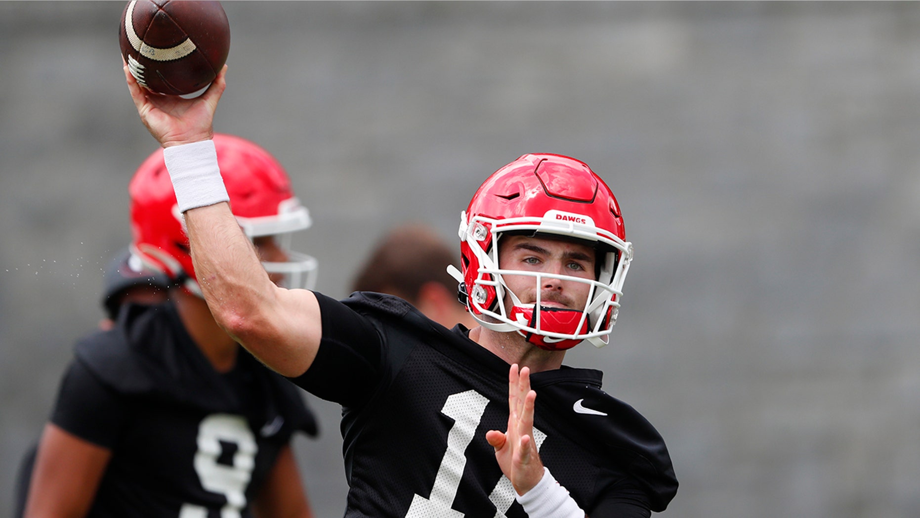 FILE - In this Aug. 2, 2019, file photo, Georgia quarterback Jake Fromm throws a pass during the team's first scheduled NCAA college football practice in Athens, Ga. Georgia fully expects to contend for a national championship. Now, the Bulldogs have to show they can finish the job after coming tantalizingly close the last two seasons. (AP Photo/John Bazemore, File)