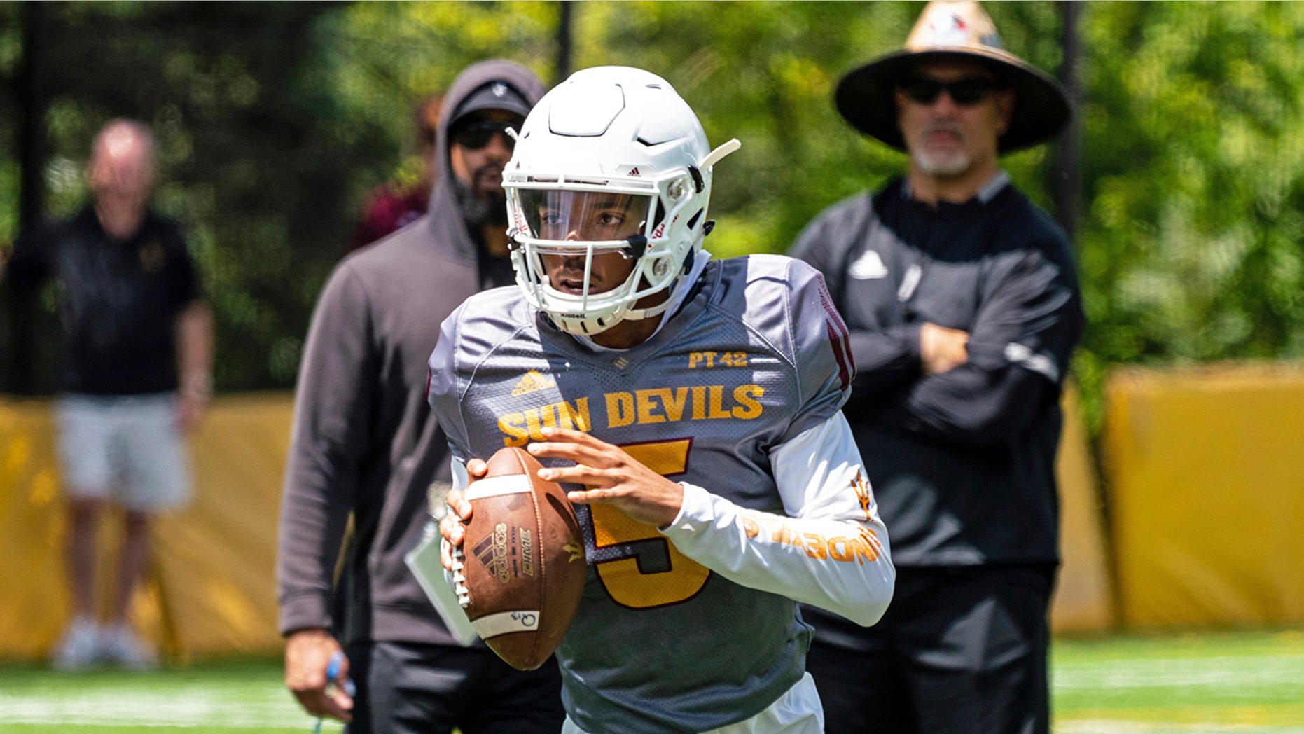 This Aug. 8, 2019, photo provided by Sun Devil Athletics shows Arizona State University freshman quarterback Jayden Daniels at practice in Payson, Ariz. Daniels will become the first Arizona State true freshman quarterback to start a season opener for the Sun Devils, as he won a four-man competition for the job. (Radmen Niven/Sun Devil Athletics via AP)