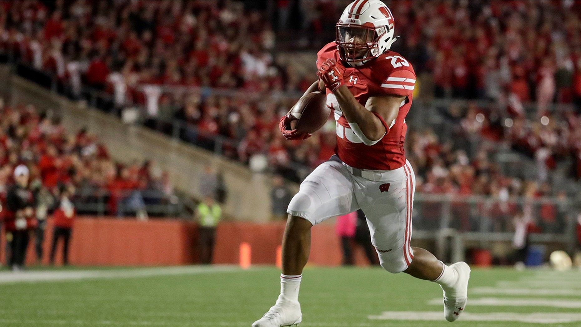 FILE - In this Oct. 6, 2018, file photo, Wisconsin's Jonathan Taylor runs for a touchdown during the second half of an NCAA college football game against Nebraska, in Madison, Wis. College football’s race for its top individual awards this season will have a couple of standout players seeking repeats. Wisconsin’s Jonathan Taylor won the Doak Walker Award as the nation’s top running back last season, while Alabama’s Jerry Jeudy earned the Fred Biletnikoff Award as college football’s most outstanding receiver. Both players are back for their junior seasons. (AP Photo/Morry Gash, File)