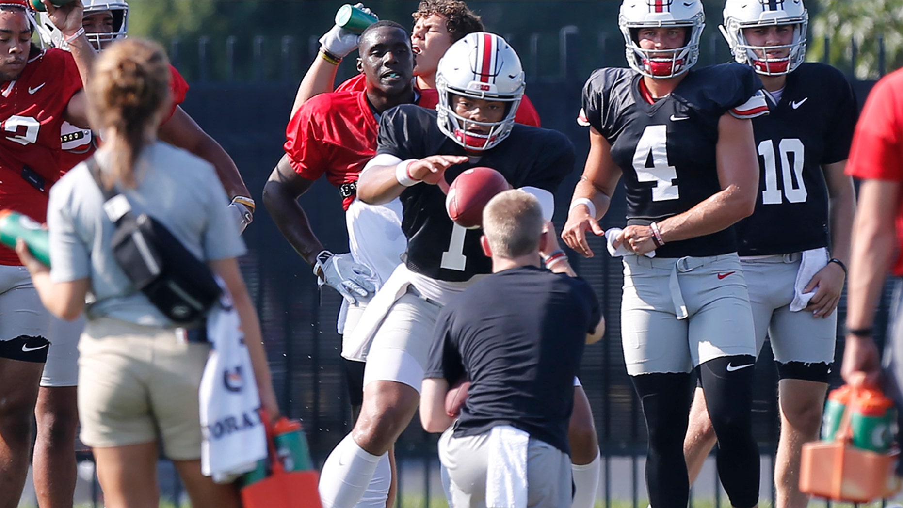 Ohio State quarterback Justin Fields takes a snap during their NCAA college football practice Tuesday, Aug. 6 2019, in Columbus, Ohio. (AP Photo/Jay LaPrete)