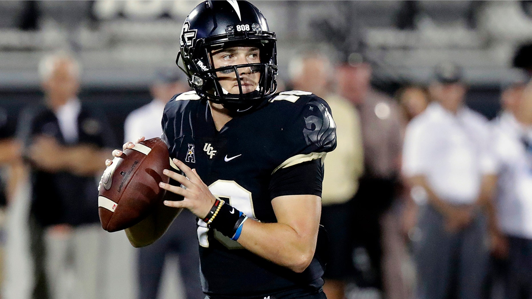 FILE - In this Sept. 21, 2018, file photo, Central Florida quarterback McKenzie Milton looks for a receiver during the first half of an NCAA college football game against Florida Atlantic in Orlando, Fla. Part of the sales pitch that lured Milton from his home state of Hawaii to UCF was a pledge by then-Knights coach Scott Frost to help put the quarterback on a path to a post-playing career in coaching. (AP Photo/John Raoux, File)