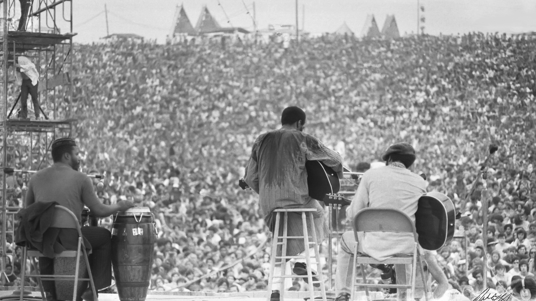 This August, 1969 photo shows Richie Havens as he performs during Woodstock in Bethel, N.Y. The photo is only one of hundreds made by photographer Mark Goff who, at the time, worked for an underground newspaper in Milwaukee, Wis. Some were published, but the negatives were filed away at his Milwaukee home and barely mentioned as Goff raised two daughters, changed careers and, last November, died of cancer. Dozens of Goff's Woodstock shots are being displayed 50 years later. (Mark Goff Photography, Leah Demarco/Allison Goff via AP)