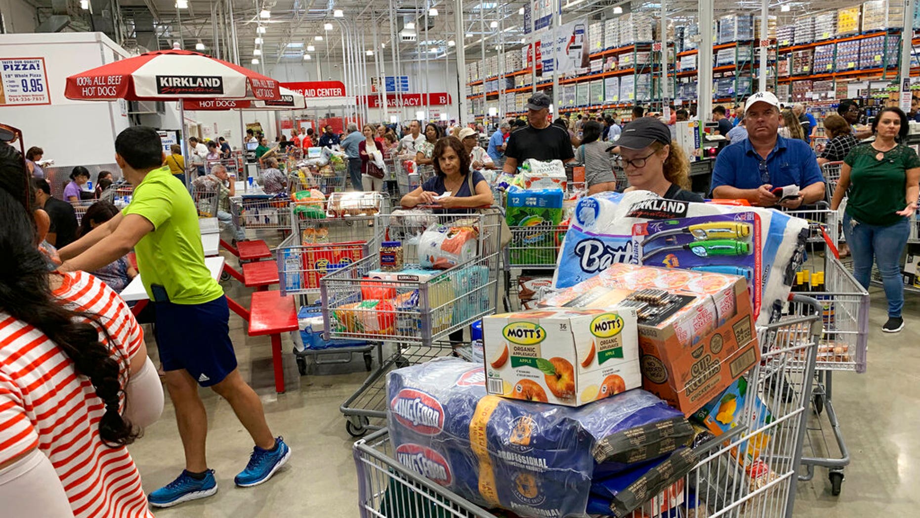 Shoppers wait in long lines at Costco, Thursday, Aug. 29, 2019, in Davie, Fla., as they stock up on supplies ahead of Hurricane Dorian. (AP Photo/Brynn Anderson)