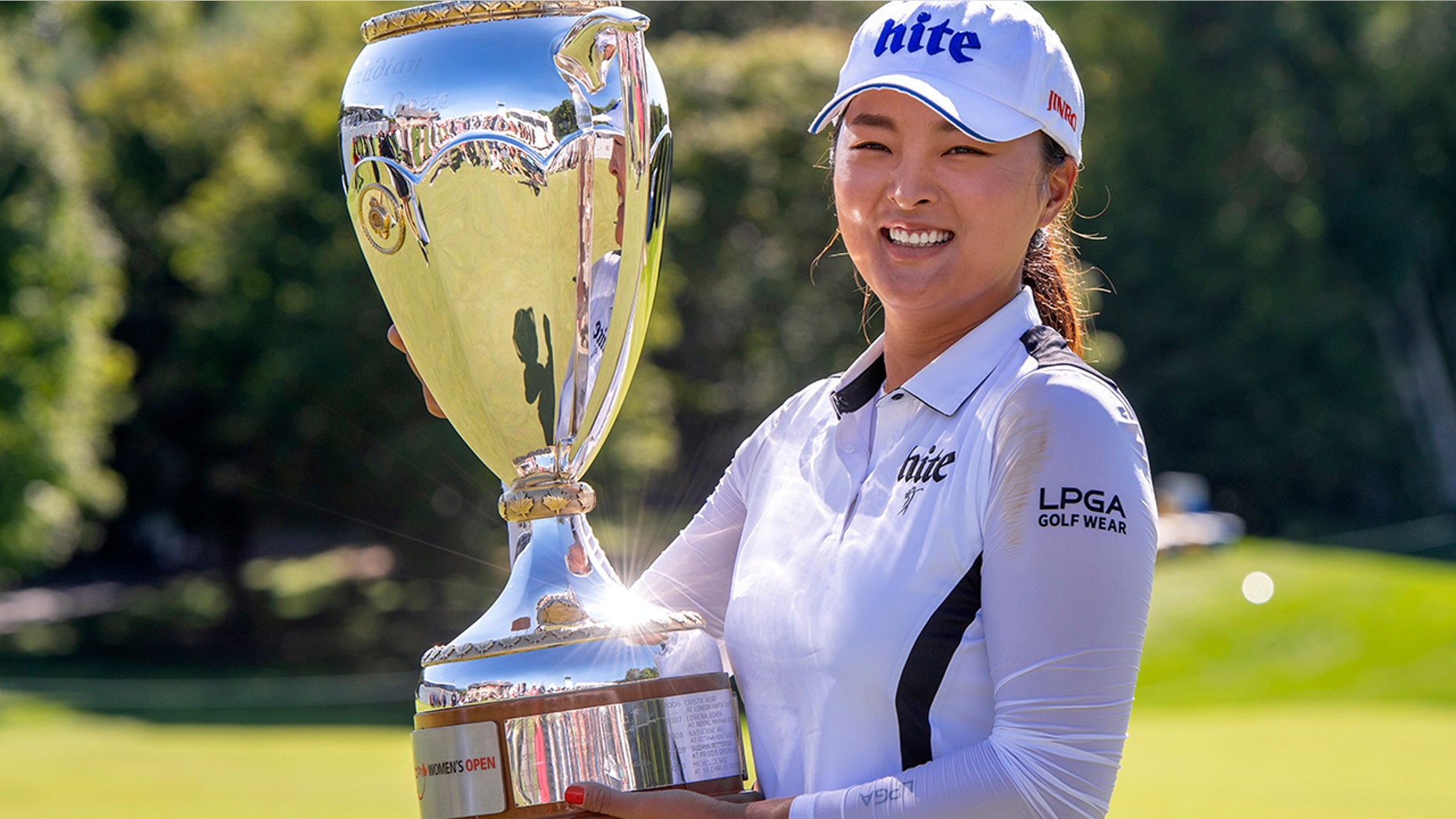 Jin Young Ko of South Korea poses with the trophy after winning the CP Women's Open in Aurora, Ontario, Sunday, Aug. 25, 2019. (Frank Gunn/The Canadian Press via AP)