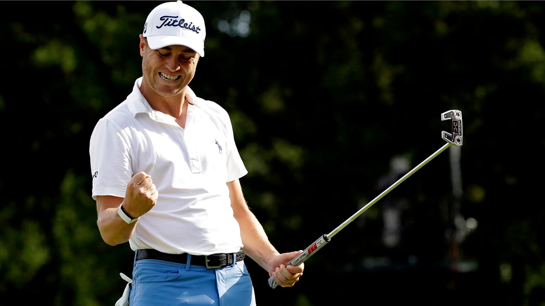 Justin Thomas celebrates after making a birdie on the 18th green during the final round at the BMW Championship golf tournament at Medinah Country Club, Sunday, Aug. 18, 2019, in Medinah, Ill. (AP Photo/Nam Y. Huh)