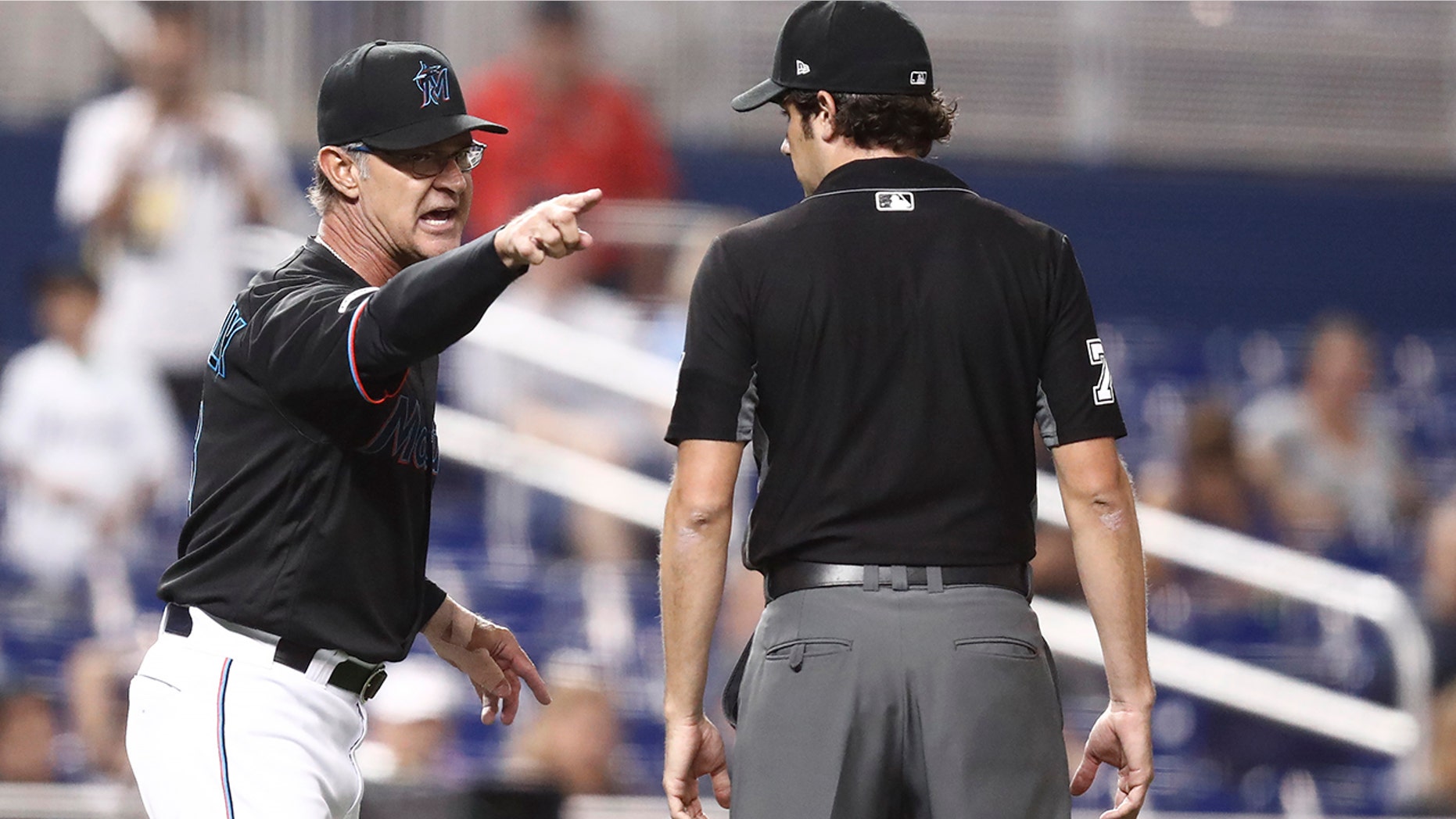 Miami Marlins manager Don Mattingly yells towards umpire John Tumpane after a balk call was made on Miami Marlins starting pitcher Caleb Smith during the fifth inning of the team's baseball game against the Atlanta Braves on Friday, Aug. 9, 2019, in Miami. Mattingly was thrown out of the game. (AP Photo/Brynn Anderson)