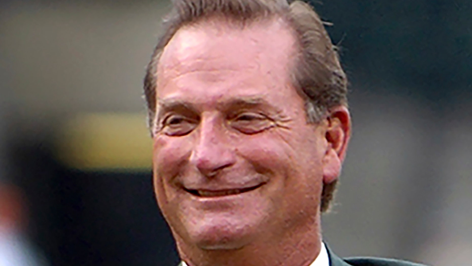 FILE - In this Aug. 26, 2006, file photo, former Baltimore Orioles baseball player Doug DeCinces smiles after being inducted into the Orioles Hall of Fame during a ceremony in Baltimore. DeCinces has been sentenced to eight months of home detention and ordered to pay a $10,000 fine for his role in an insider-trading scheme. (AP Photo/Gail Burton, File)