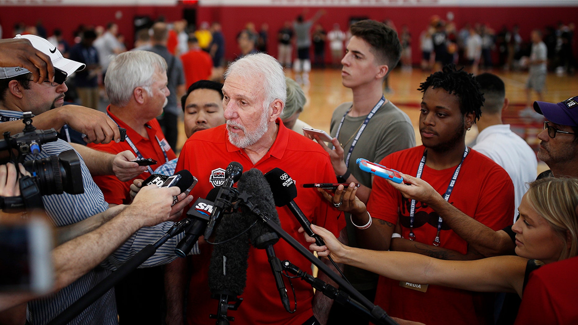 FILE - In this July 26, 2018, file photo, head coach head coach Gregg Popovich speaks with the media during a training camp for USA Basketball, in Las Vegas. USA Basketball opened training camp Monday, Aug. 5, 2019, for the FIBA World Cup, which starts Aug. 31 in China. (AP Photo/John Locher, File)