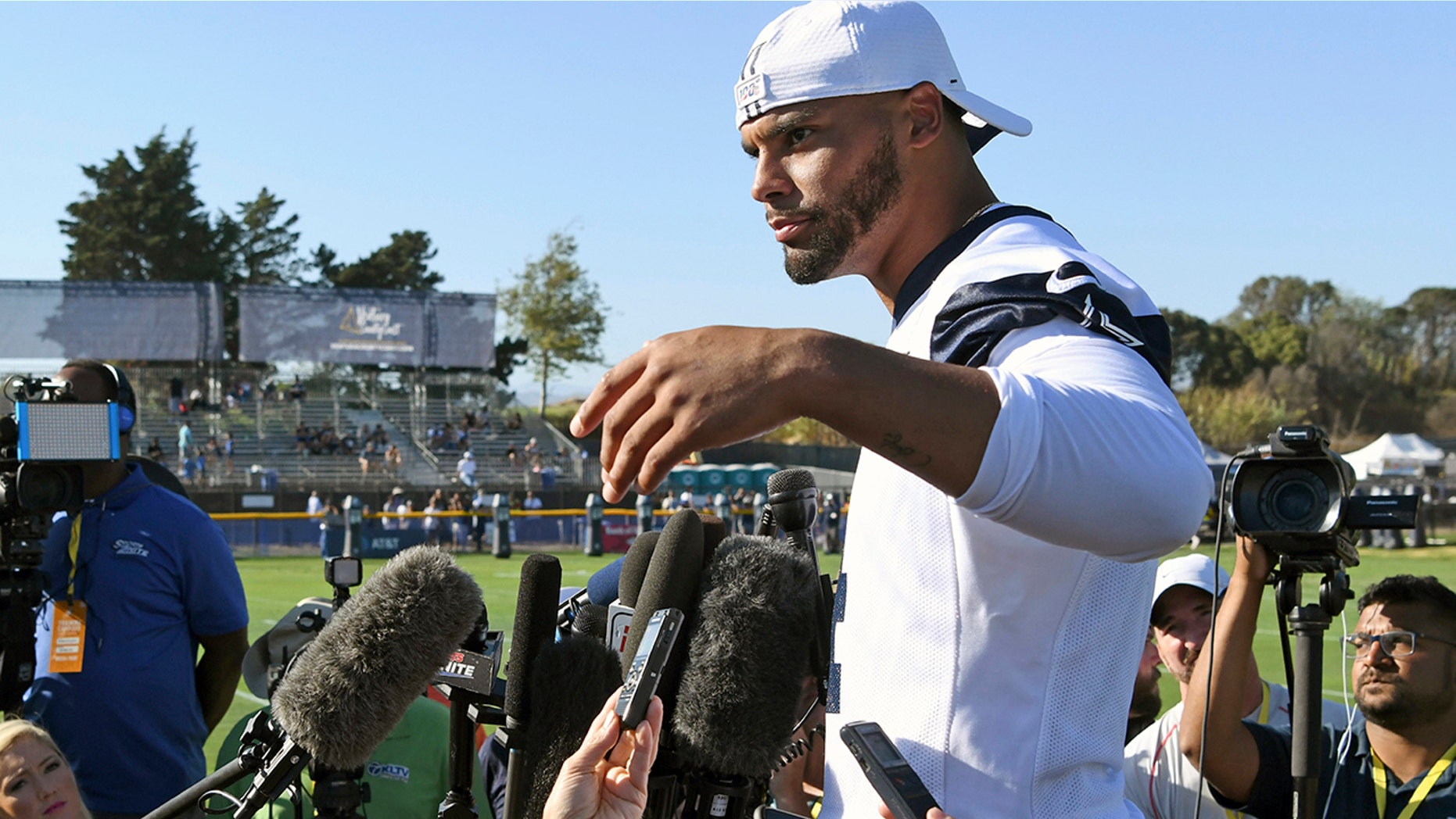 Dak Prescott pretends he can’t hear the question when the subject turns to a new contract for the star quarterback of the Dallas Cowboys, while receiver Amari Cooper steadfastly says he simply doesn’t think about what might be happening in his negotiations. Both reported to training camp on time as they prepare for the final year of their respective deals. (AP Photo/Michael Owen Baker, File)