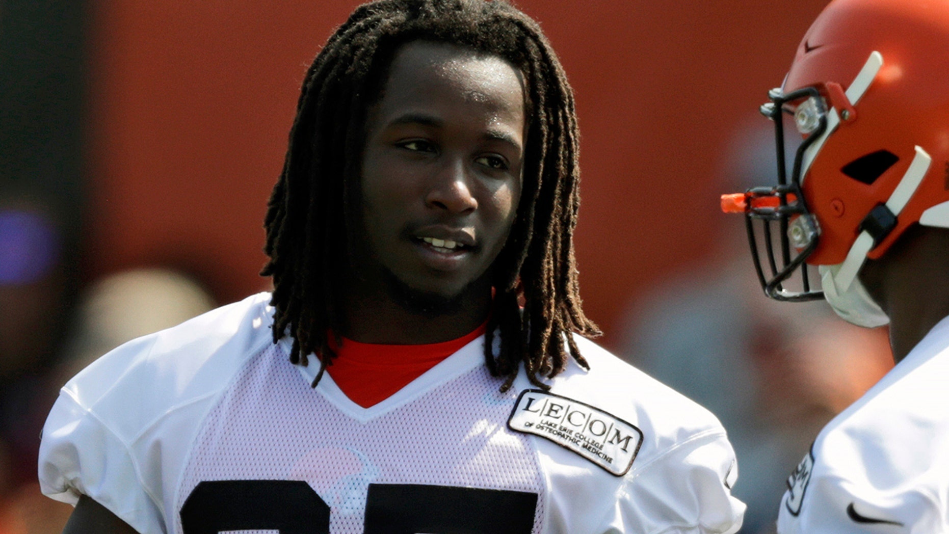 FILE - In this July 25, 2019, file photo, Cleveland Browns running back Kareem Hunt, left, talks with running back Nick Chubb during practice at the NFL football team's training camp facility, in Berea, Ohio. (AP Photo/Tony Dejak, File)