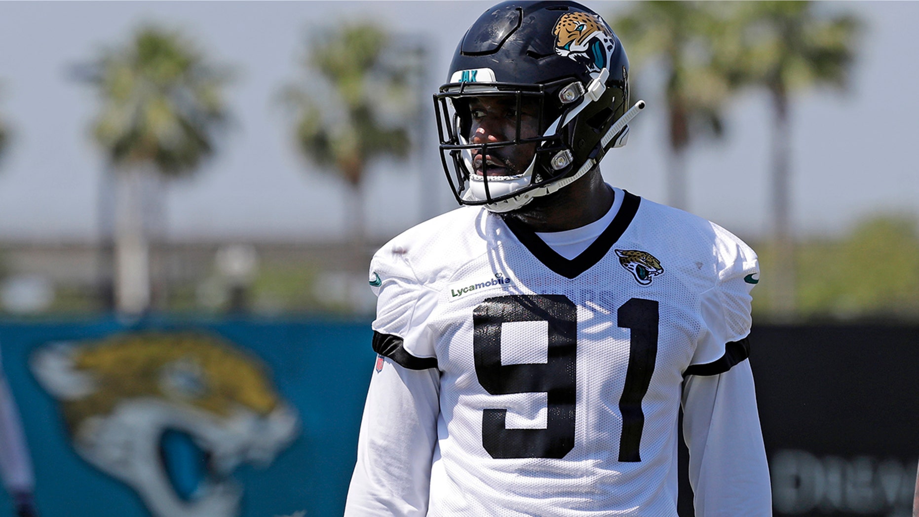 FILE - In this May 21, 2019, file photo, Jacksonville Jaguars defensive end Yannick Ngakoue (91) prepares for drills during an NFL football practice in Jacksonville, Fla. (AP Photo/John Raoux, File)