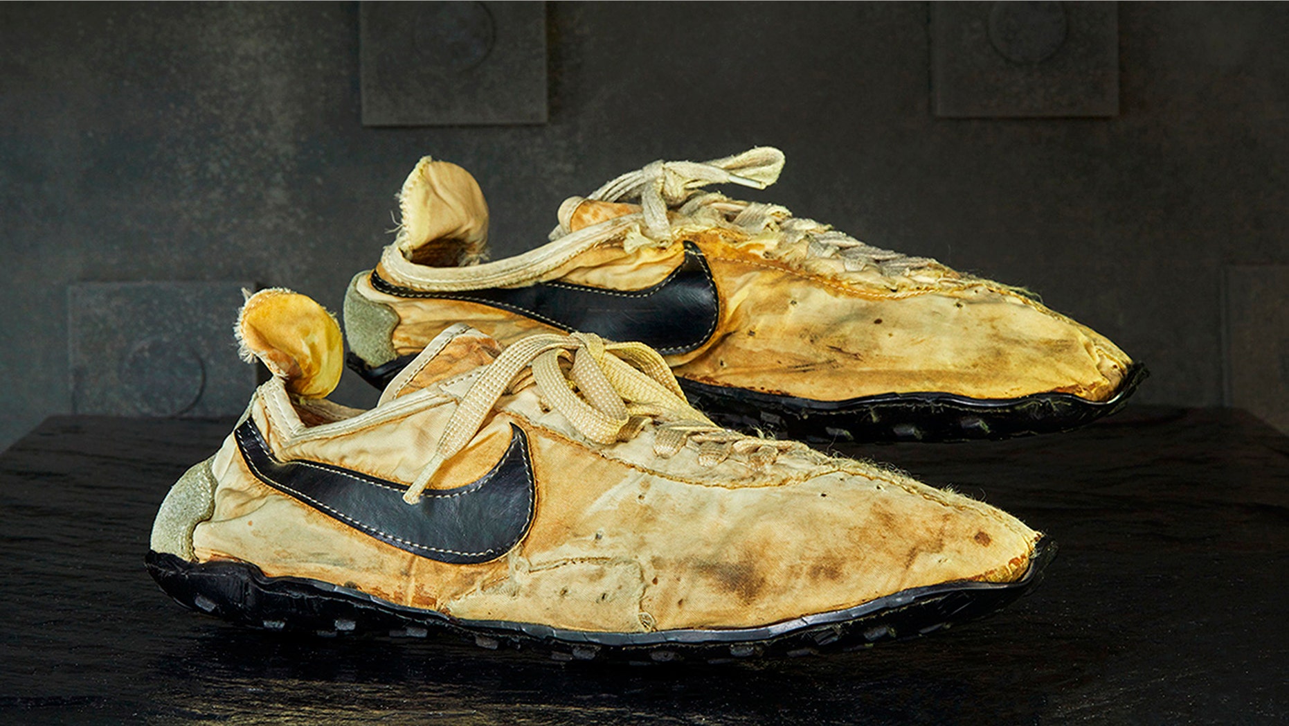 This undated photo provided by Graduate Hotels shows a pair of handmade Nike track shoes from the 1972 Olympic trials. The pair of Nike track shoes has sold for $50,000. (Christian Horan/Graduate Hotels via AP)