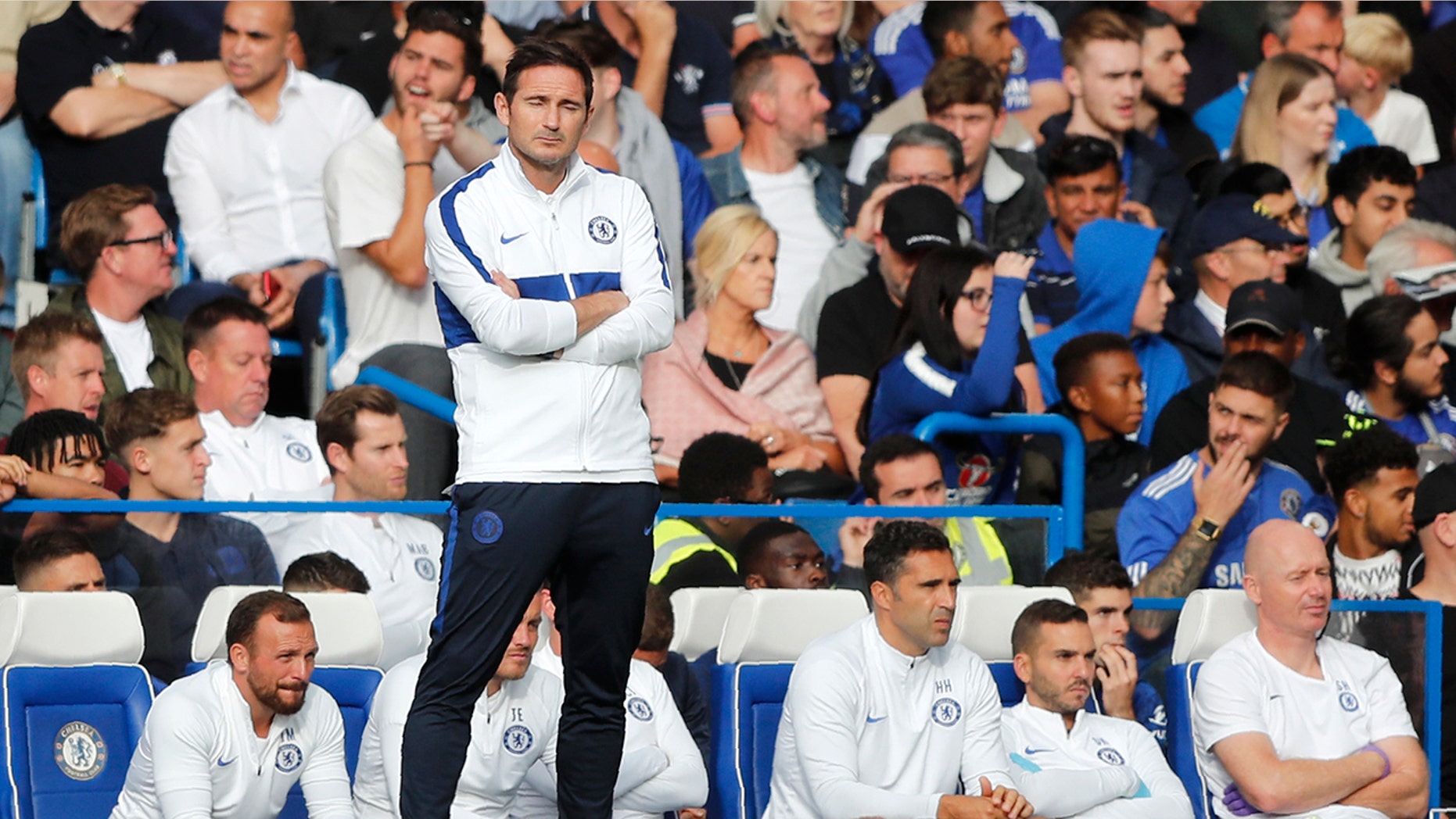 Chelsea's head coach Frank Lampard stands by the bench after Leicester tied the game 1-1 during the English Premier League soccer match between Chelsea and Leicester City at Stamford Bridge stadium in London, Sunday, Aug. 18, 2019. (AP Photo/Frank Augstein)