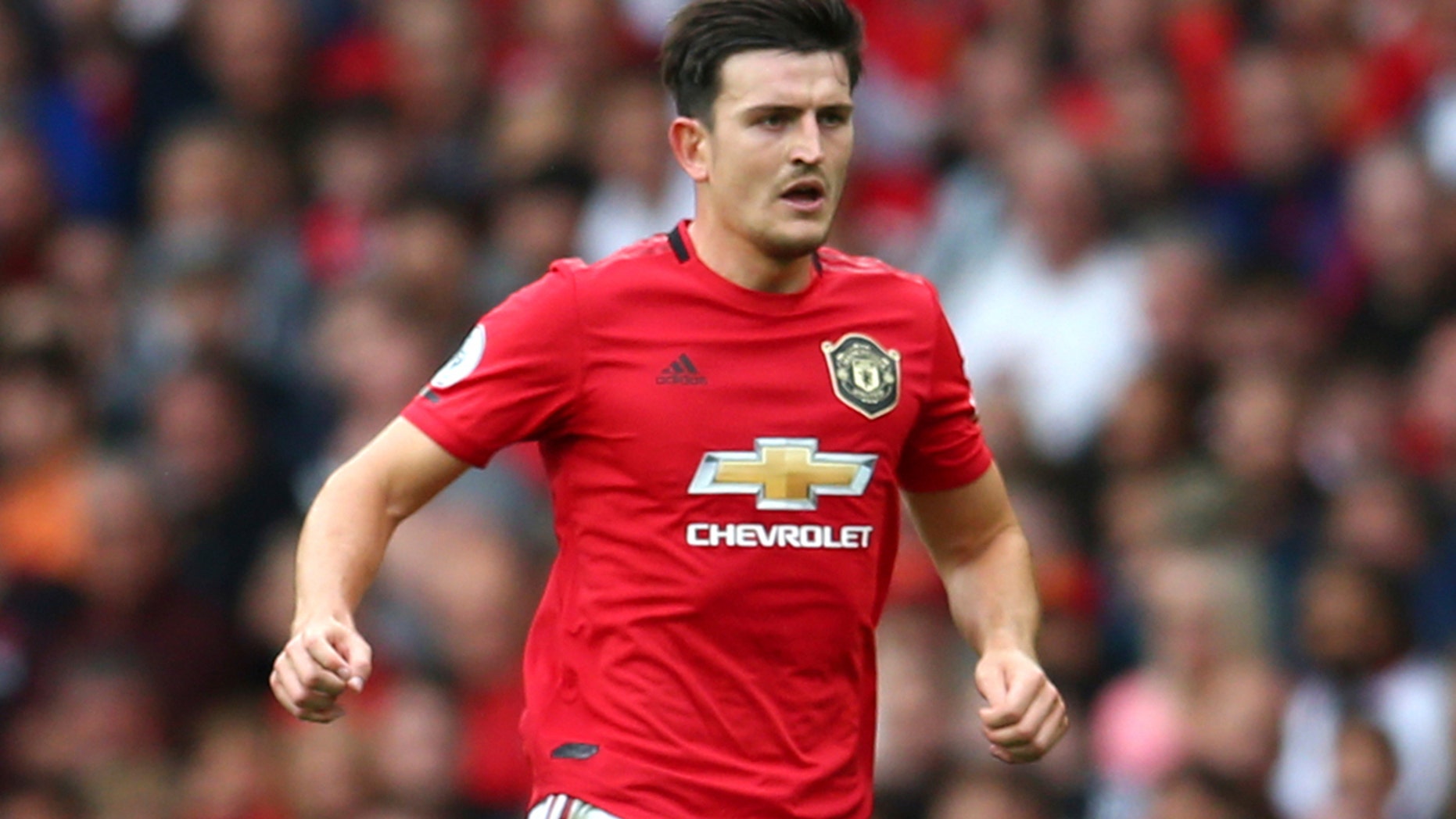 Manchester United's Harry Maguire controls the ball during the English Premier League soccer match between Manchester United and Chelsea at Old Trafford in Manchester, England, Sunday, Aug. 11, 2019. (AP Photo/Dave Thompson)