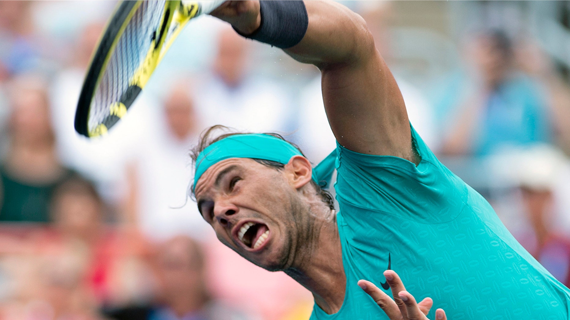 Rafael Nadal of Spain serves to Daniel Evans of Britain during the Rogers Cup men’s tennis tournament Wednesday, Aug. 7, 2019, in Montreal. (Paul Chiasson/The Canadian Press via AP)