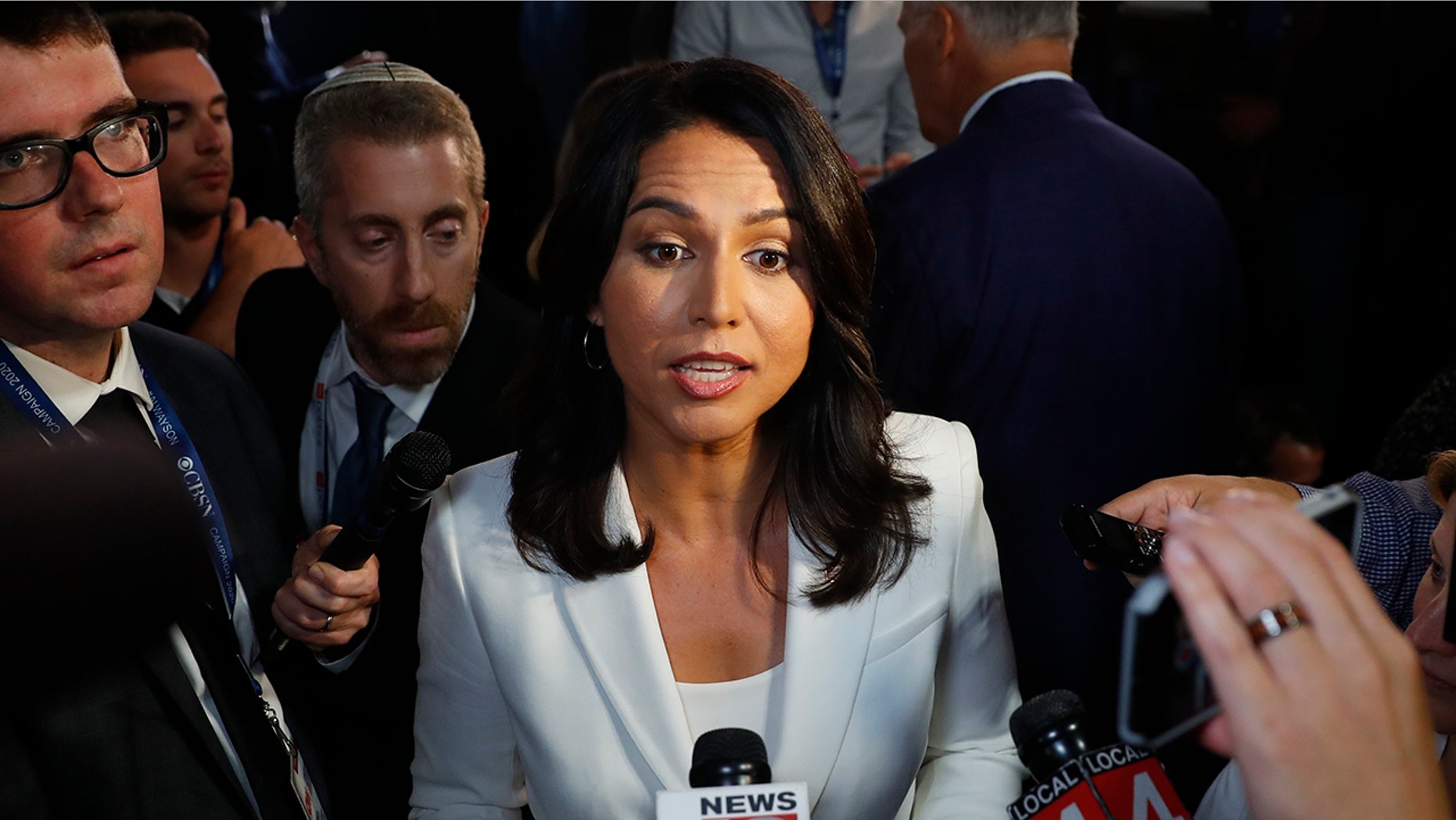 Rep. Tulsi Gabbard, D-Hawaii, answers questions after the second of two Democratic presidential primary debates hosted by CNN Thursday, Aug. 1, 2019, in the Fox Theatre in Detroit. (AP Photo/Paul Sancya)