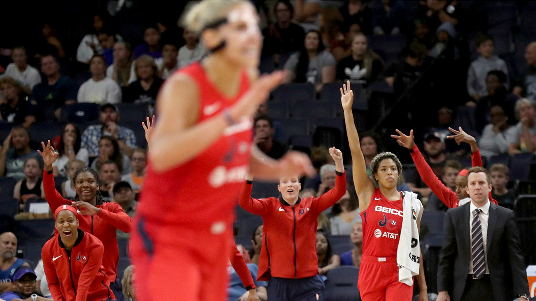 The Washington Mystics' bench celebrates a 3-point basket in the final minute of the team's 86-79 win over the Minnesota Lynx during a WNBA basketball game Friday, Aug. 16, 2019, in Minneapolis. (David Joles/Star Tribune via AP)