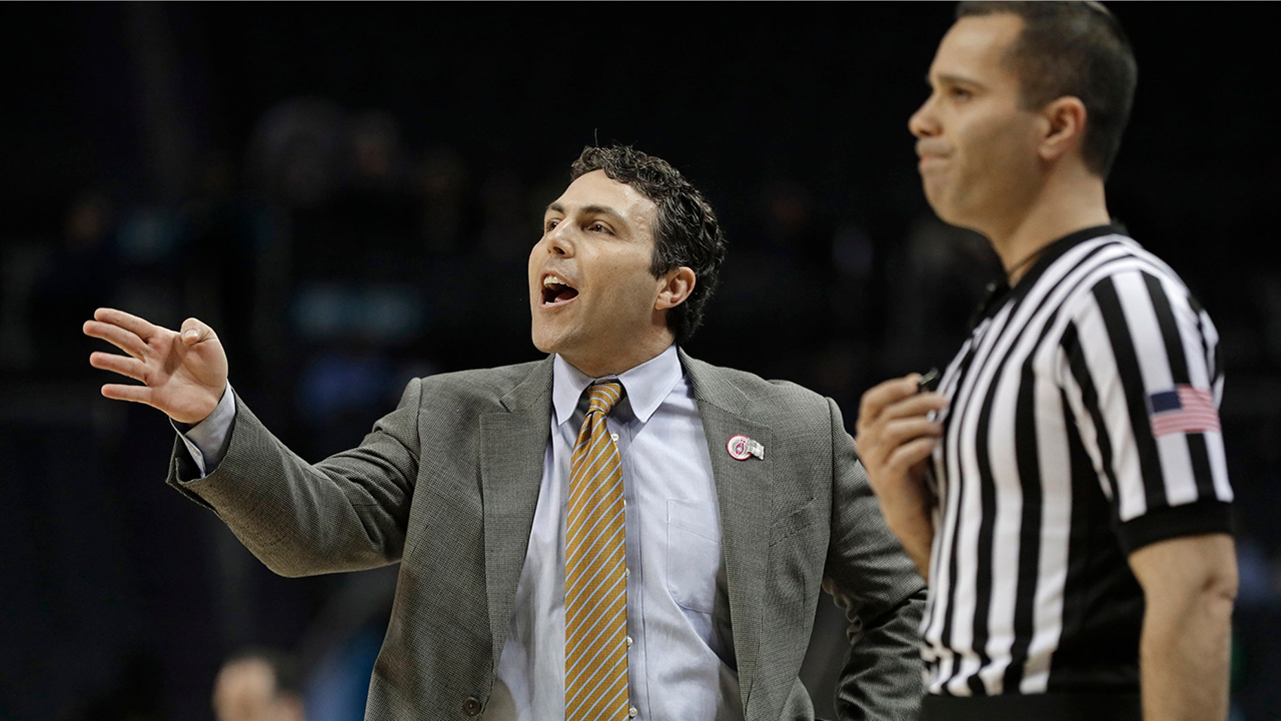 FILE - In this March 12, 2019, file photo, Georgia Tech head coach Josh Pastner, left, directs his team against Notre Dame during the first half of an NCAA college basketball game in the Atlantic Coast Conference tournament, in Charlotte, N.C. (AP Photo/Nell Redmond, File)