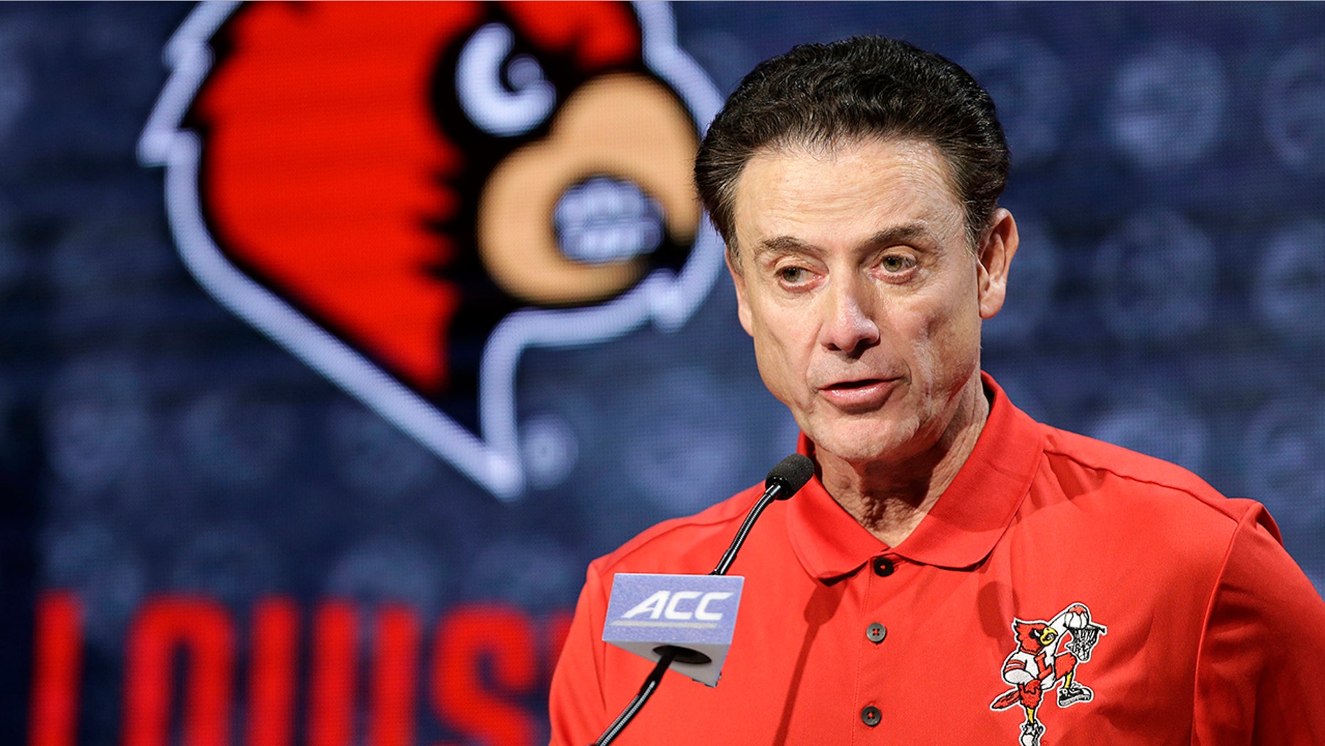 FILE - In this Oct. 26, 2016, file photo, Louisville NCAA college basketball head coach Rick Pitino answers a question during the Atlantic Coast Conference media day in Charlotte, N.C. (AP Photo/Bob Leverone, FIle)