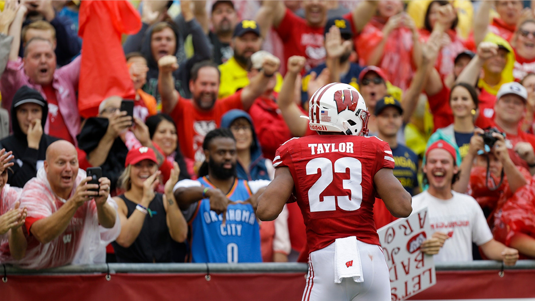 Wisconsin running back Jonathan Taylor celebrates a touchdown against Michigan during the first half of an NCAA college football game Saturday, Sept. 21, 2019, in Madison, Wis. (AP Photo/Andy Manis)
