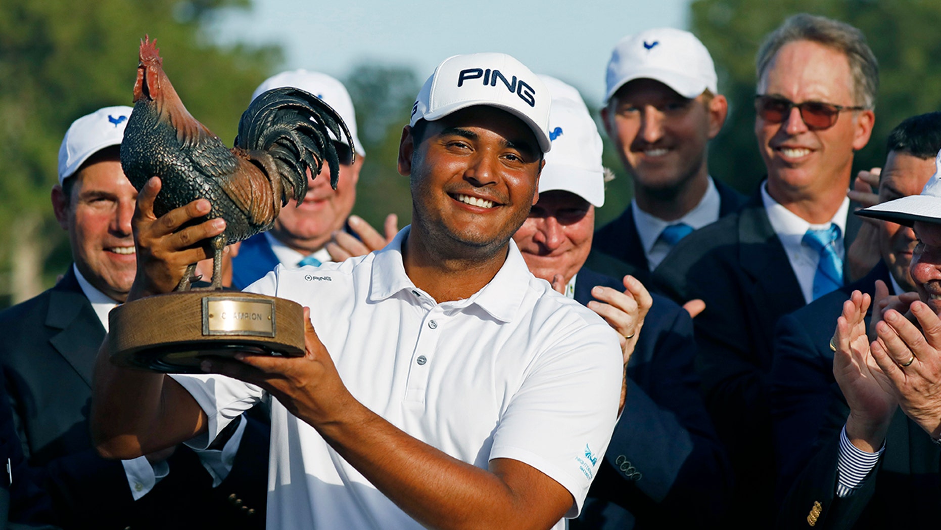 Sebastian Munoz, of Colombia, hoists the trophy after winning the Sanderson Farms Championship golf tournament in Jackson, Miss., Sunday, Sept. 22, 2019. (AP Photo/Rogelio V. Solis)